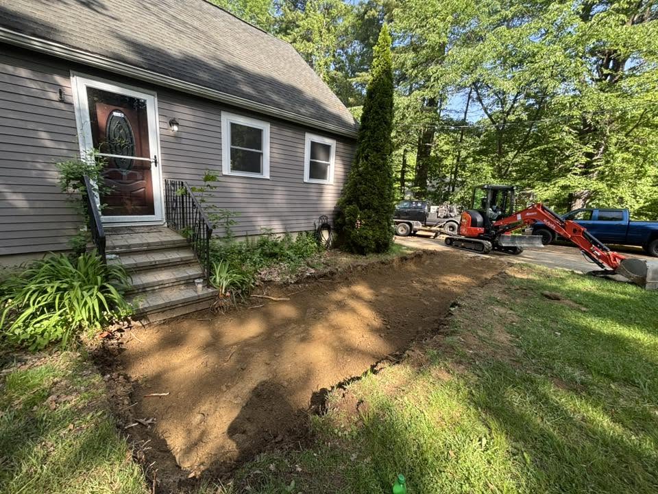 Graded and leveled walkway area after excavation — paver ready